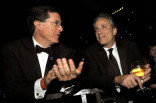 Television hosts Stephen Colbert (L) and Jon Stewart