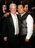 Producer Spike Jones and host Carlos Mencia 