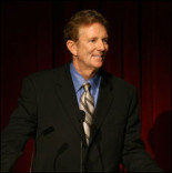 Television Academy Chair Dick Askin addresses the packed theatre.