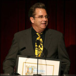The evening's host Beau Bridges holds the Television Academy's congratulatory proclamation from the City of Los Angeles.