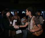 Mara Brock Akil (r.), producer of CW series Girlfriends, talks with NEXT TV attendee.