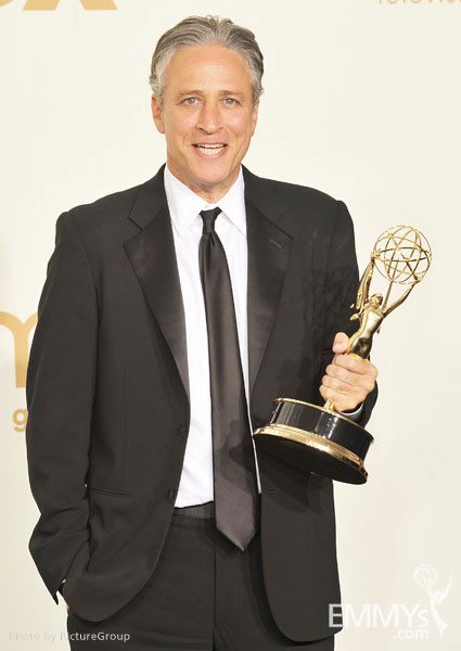 Jon Stewart poses with the award for "Outstanding Variety, Music or Comedy Series" in the press room