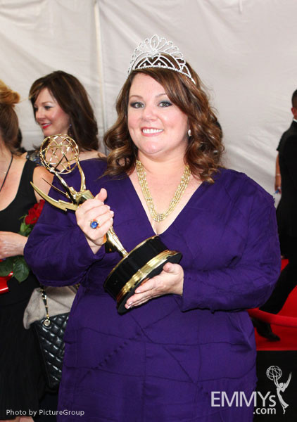 Melissa McCarthy with the award for "Outstanding Lead Actress in a Comedy Series" at the trophy table