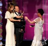 Stana Katic (L) and Andrew W. Marlowe present the Oustanding Hairstyling For A Miniseries or Movie 