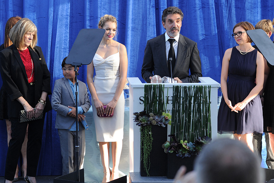 Chuck Lorre (at podium) accepts the Television Academy Honors award for CBS series Mom, alongside Mimi Kennedy, Blake Garrett Rosenthal, Sadie Calvano and Gemma Bakerthe at the seventh Honors ceremony in Beverly Hills, California. 