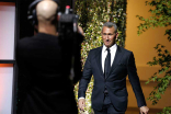 Adam Shenkman enters the stage at the 37th College Television Awards at the Skirball Cultural Center on Wednesday, May 25, 2016, in Los Angeles.