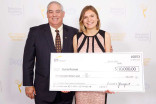 Bill Isler of the Fred Rogers Foundation presents an award check to Sylvia Rusnak at the 37th College Television Awards at the Skirball Cultural Center on Wednesday, May 25, 2016, in Los Angeles.