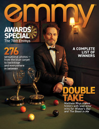 Matthew Rhys covers emmy magazine, Issue 12, 2026, posing in a tuxedo besides two Emmy Awards.