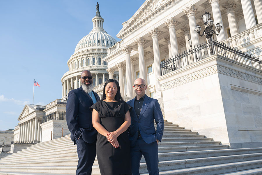 Members of the Advocacy Committee pose on the Capitol steps before a full day of meetings with congressional offices. (L to R: Renard Jenkins, Chair Christina Lee Storm, and David Hartle.)