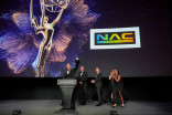 Casey Noel, Jesse Noel, Mark T. Noel and J.D. Schwalm accept the Emmy for the development of the NACMO series of motion bases