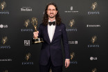 Ian Sampson poses with the Emmy