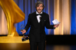Jon Philpot accepts the Emmy for Outstanding Picture Editing for a Single-Camera Comedy Series for the Finale of Hacks during night two of the 78th Emmy Awards