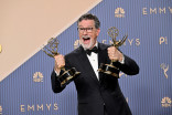 Stephen Colbert is seen backstage with the Emmy for Outstanding Variety Series during the 78th Emmy Awards telecast