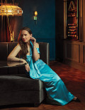 Lena Hall in a blue gown posing in the Emmy Photo Studio