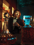 Matty Matheson in a tuxedo, holding a cocktail in the Emmy Photo Studio