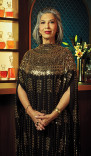 Rose Abdoo in a gown poses in the Emmy Photo Studio