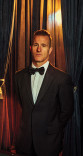Scott Caan poses in a tuxedo in the Emmy Photo Studio