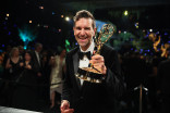 Mike Cotton, winner for Outstanding Reality Competition Program for The Traitors, has their statuette personalized during the 78th Emmy Awards Governors Gala