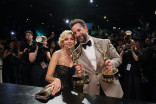 Sara Wells accompanies Noah Wyle, winner of Outstanding Lead Actor in a Drama Series and Outstanding Drama Series for The Pitt has their statuette personalized during the 78th Emmy Awards Governors Gala