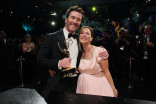Kaley Cuoco and Tom Pelphrey, winner of Outstanding Supporting Actor in a Drama Series for Task, has their statuette personalized during the 78th Emmy Awards Governors Gala