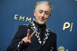 Alan Cumming walks the red carpet at the 78th Emmy Awards telecast