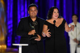 Robert Lopez and Kristen Anderson-Lopez accept an award at the 2021 Creative Arts Emmys.
