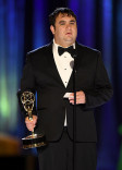 Brian Spett accepts an award at the 2021 Creative Arts Emmys.