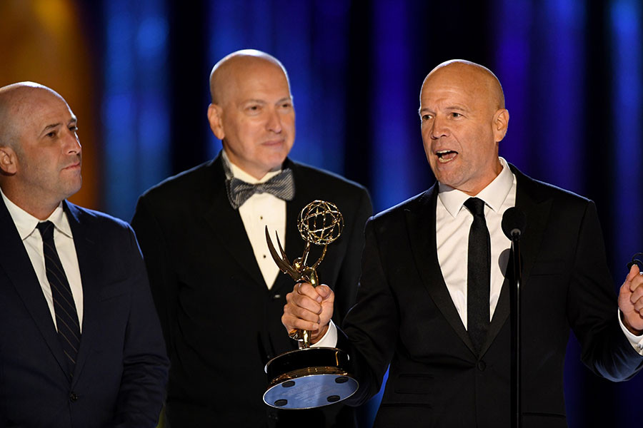 William McGuinness, Trevor Brown and Tim Stasse accepts an award during the 2021 Creative Arts Emmy Awards.