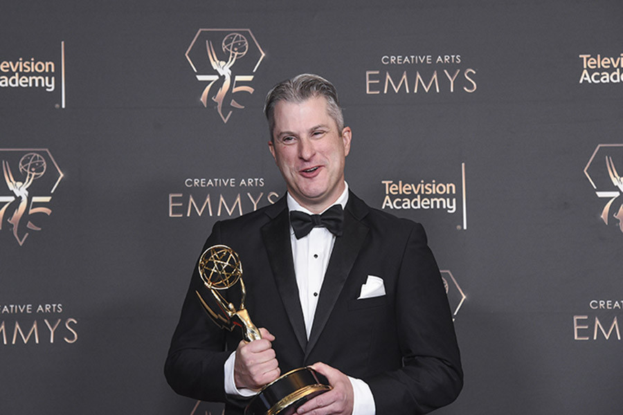 Chris Poulos of Night Court in the press room at the 75th Creative Arts Emmy Awards