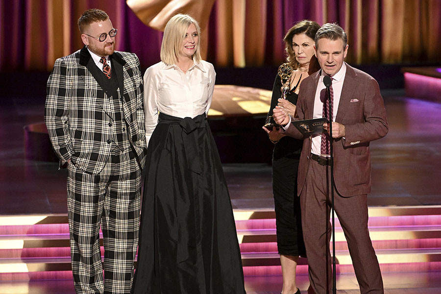 Colleen Atwood, Adina Bucur, Claudia Littlefield, Robin Soutar, and Mark Sutherland accept the award for Outstanding Contemporary Costumes for a Series for Wednesday at the 75th Creative Arts Emmy Awards