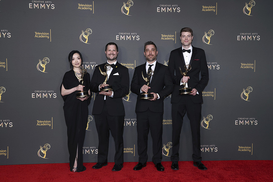 Nadia Tzuo, Alex Silver, Lee Buckley and Evan Larimore backstage with their award for Outstanding Main Title Design for Shōgun at the 76th Creative Arts Emmy Awards