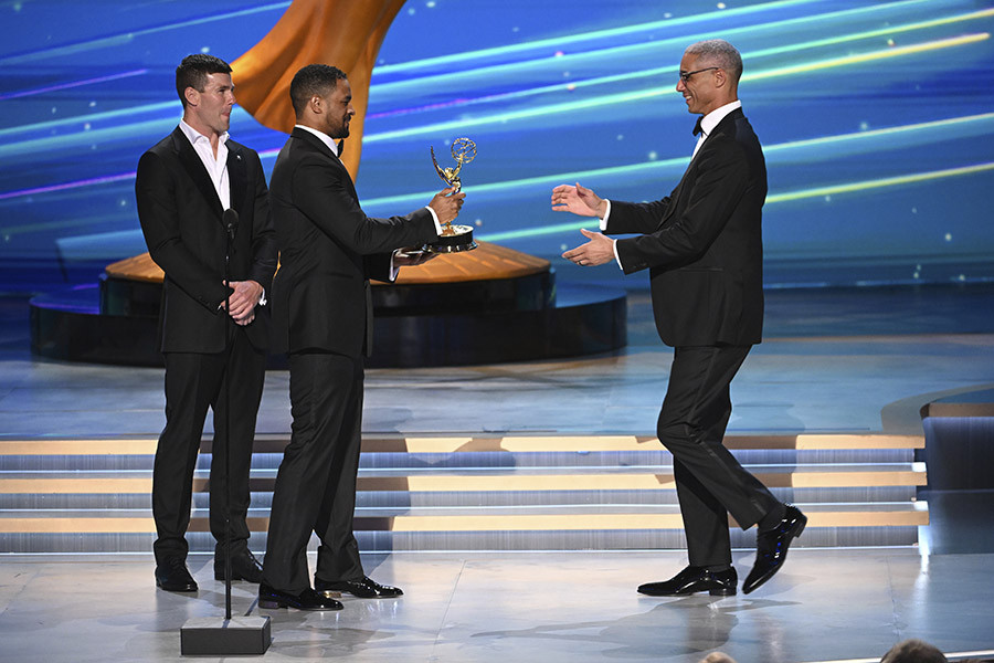 Austin Stowell and Damon Wayans Jr. present the award for Outstanding Stunt Coordination for Drama Programming to Stephen Pope for Mrs &amp; Mrs. Smith at the 76th Creative Arts Emmy Awards