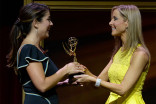 Carolina Cavaliere accepts her award from Lisa Sigell at the 67th Los Angeles Area Emmy Awards July 25, 2015, at the Skirball Cultural Center in Los Angeles, California.