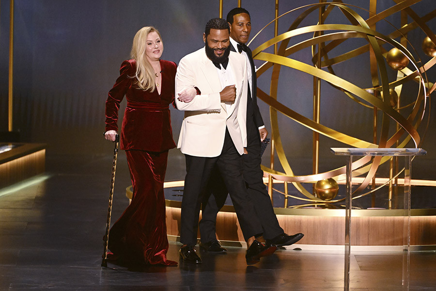 Christina Applegate from Dead to Me and host Anthony Anderson onstage at the 75th Emmy Awards 