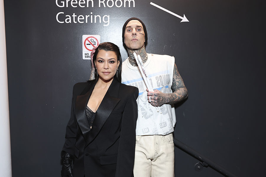 Kourtney Kardashian Barker and Travis Barker backstage at the 75th Emmy Awards 