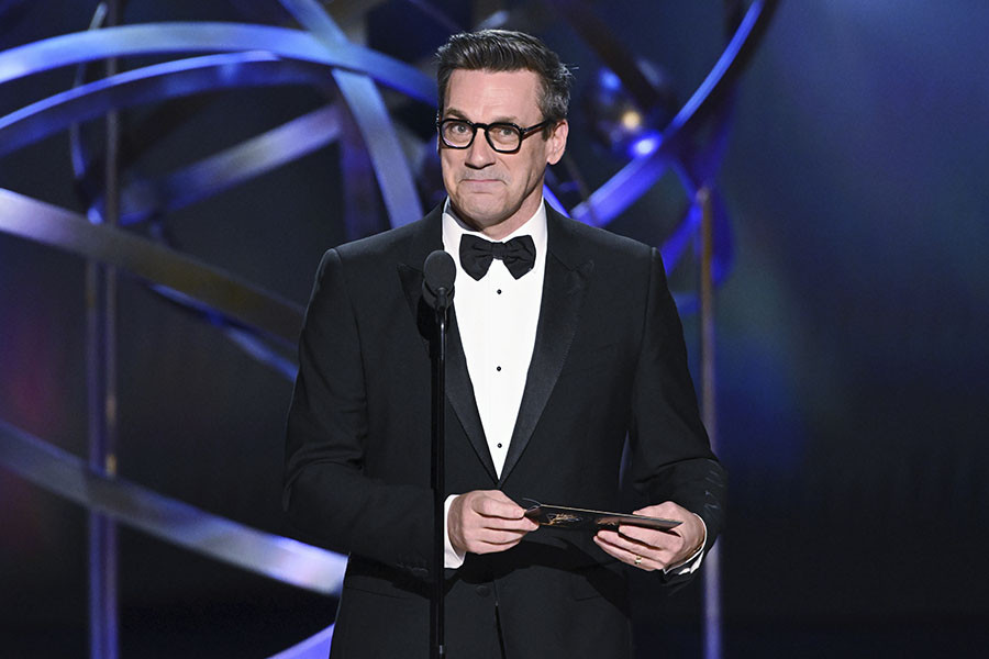 Jon Hamm presents an award at the 75th Emmy Awards