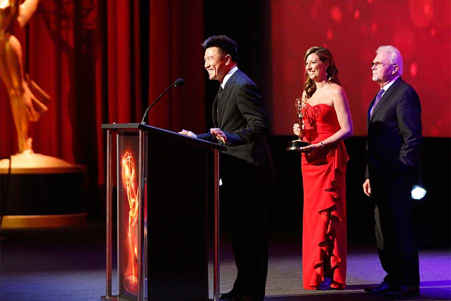 Adam Zhu accepts an award at the 68th Los Angeles Area Emmys, July 23, 2016, at the Saban Media Center, North Hollywood, California.