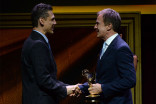 Antonio Camberos accepts his award from Robert Kovacik at the 67th Los Angeles Area Emmy Awards July 25, 2015, at the Skirball Cultural Center in Los Angeles, California.