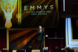 Host Scott Aukerman entertains the audience at the 67th Los Angeles Area Emmy Awards July 25, 2015, at the Skirball Cultural Center in Los Angeles, California.