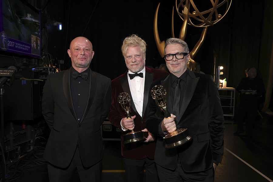 Adrian Curelea, Robert Hepburn, and Mark Scruton the production design team from Wednesday backstage at the 75th Creative Arts Emmy Awards