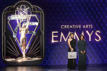 Ernst and Young accountants onstage at the 75th Creative Arts Emmy Awards