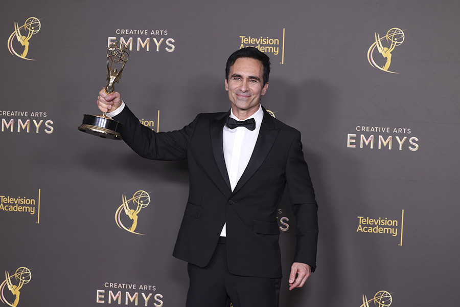 Néstor Carbonell poses with his award for Outstanding Guest Actor In A Drama Series For Shōgun backstage at the 76th Creative Arts Emmy Awards