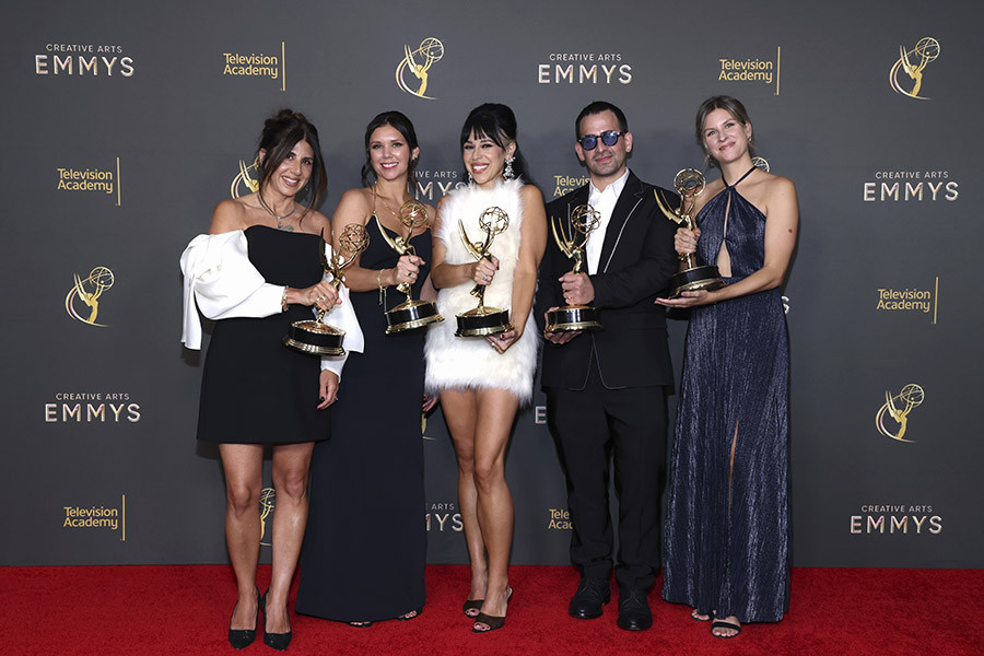 The costume team of American Horror Story poses with their award for Outstanding Contemporary Costumes for a Limited or Anthology Series or Movie backstage at the 76th Creative Arts Emmy Awards 