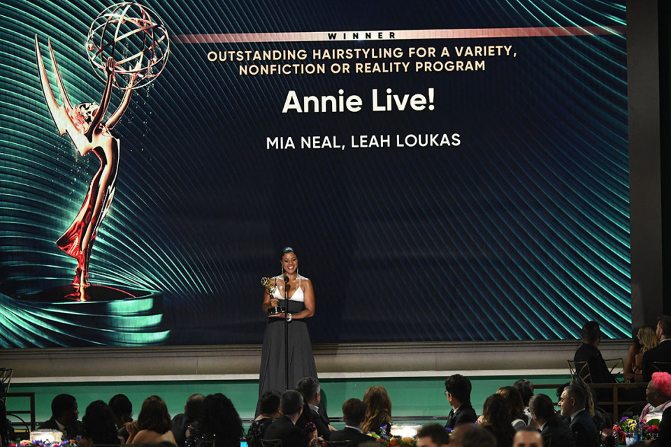Mia Neal of Annie Live! accepts the award for Outstanding Hairstyling for a Variety, Nonfiction or Reality Program at the 2022 Creative Arts Emmy Awards.