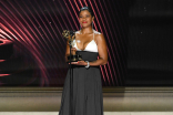 Mia Neal of Annie Live accepts an award for Outstanding Hairstyling for a Variety, Nonfiction or Reality Program at the 2022 Creative Arts Emmy Awards.