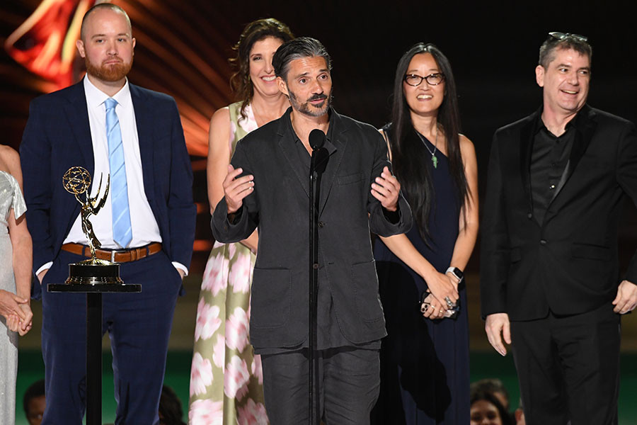 Alberto Mielgo and the team from Love, Death + Robots accept the award for Outstanding Short Form Animated Program at the 2022 Creative Arts Emmy Awards.