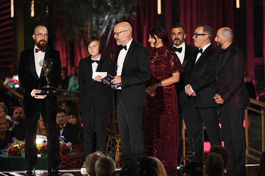 Pat Foad, Oscar Jarman, Barrie Gower, Paula Eden, Nix Herrera, Mike Mekash and Eric Garcia of Stranger Things accept the award for Outstanding Prosthetic Makeup at the 2022 Creative Arts Emmy Awards.