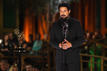 Jon Huertas on stage at the 2022 Creative Arts Emmy Awards.