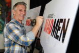 Christopher Stanley signs the poster at &quot;A Farewell to Mad Men,&quot; May 17, 2015 at the Montalbán Theater in Hollywood, California.