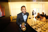 Dio Luberes with his award at the 66th Los Angeles Area Emmy Awards.